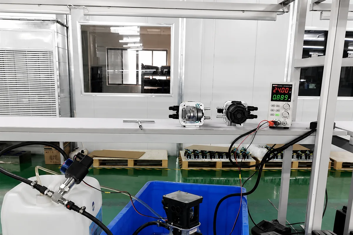 Individual urea pump connected to a powered fluid-circuit test setup