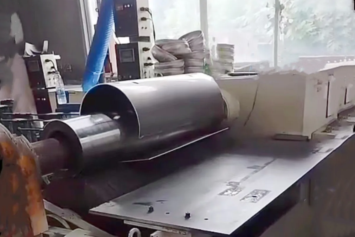 Cylindrical sheet-metal shell positioned in production equipment